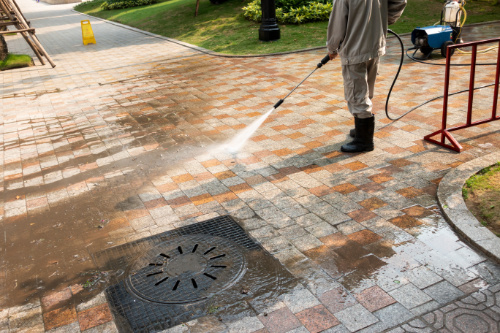 Outdoor,Floor,Cleaning,With,A,Pressure,Water,Jet,On,Street